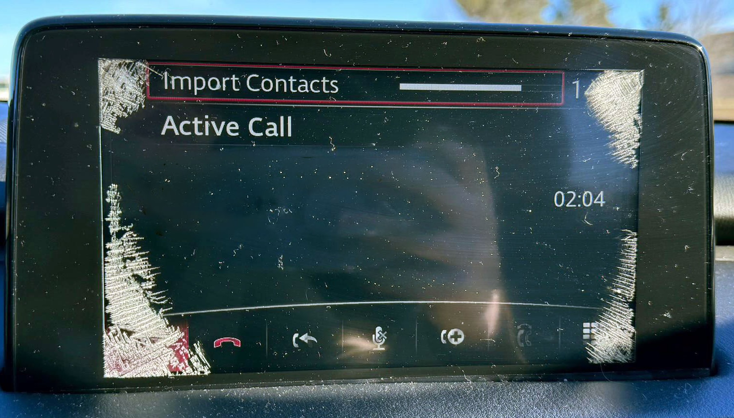 Close-up of spider cracks on a Mazda CX-9 infotainment screen