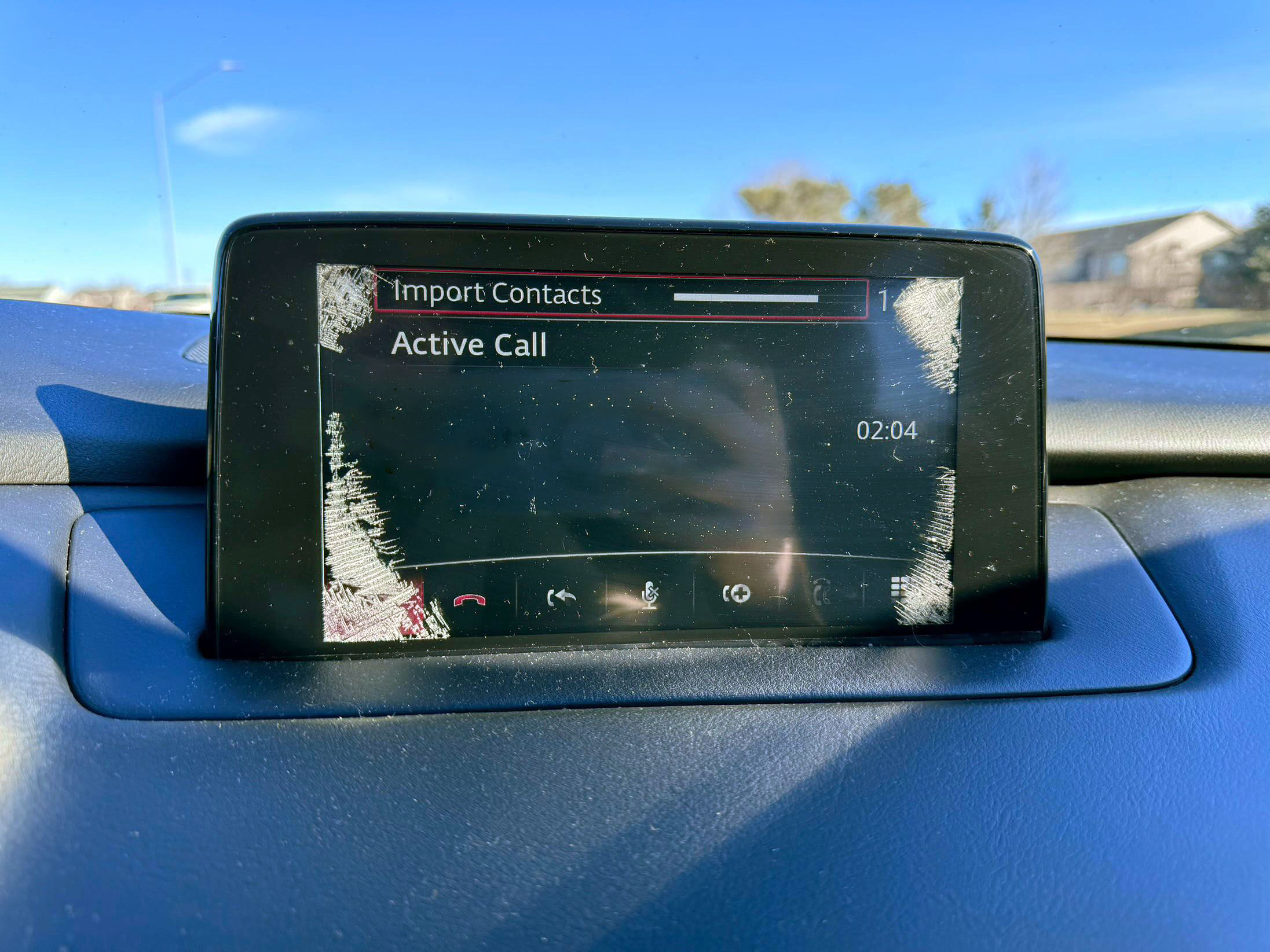Mazda MZD Connect touchscreen with spider cracks in the corners
